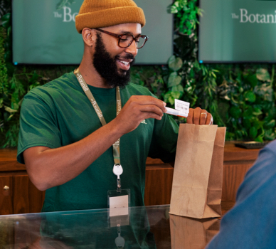 Employee placing a product into a bag