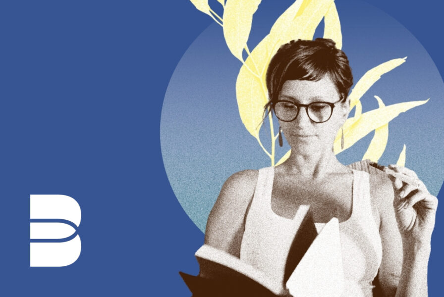 Woman holding a vape reading a book